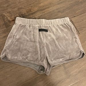 Women’s Fear of God Essentials velour shorts in Tan